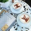 Louis Vuitton and Chanel Logo Coffee Stencils on table
