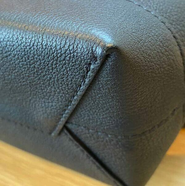 Louis Vuitton LockMe Mini Backpack Black and Gold bottom corner 1