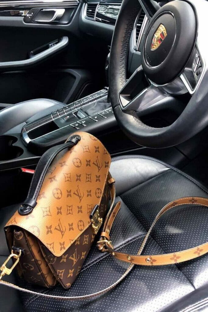 Louis Vuitton Reverse Monogram Pochette Metis bag in porcshe car