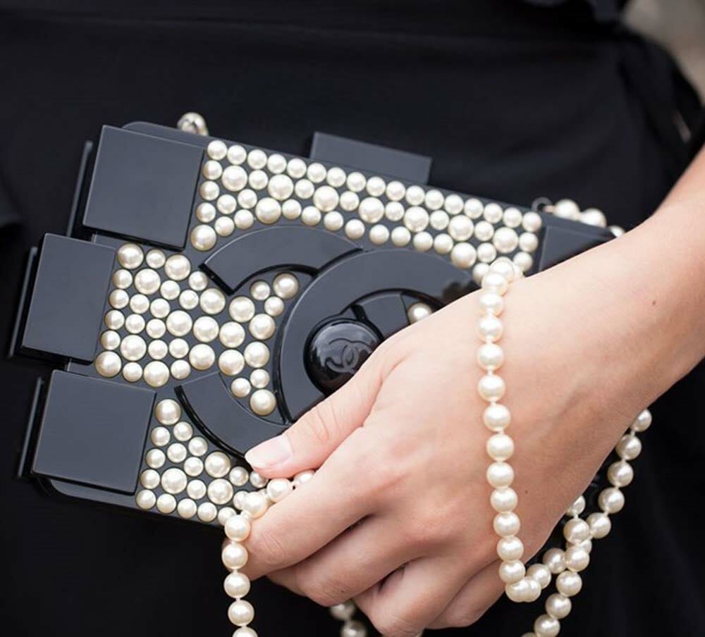 A RUNWAY PEARL & BLACK LUCITE LEGO CLUTCH WITH SILVER HARDWARE