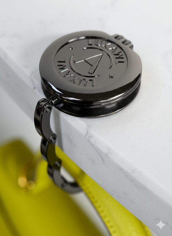 Black LUXAWL table bag hook on white marble table with lime hermes kelly bag