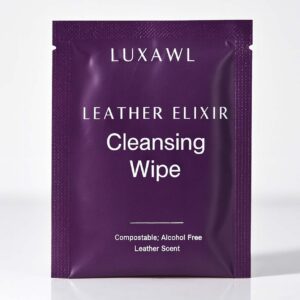 An individually packaged leather cleaning wipe in a dark purple satchet