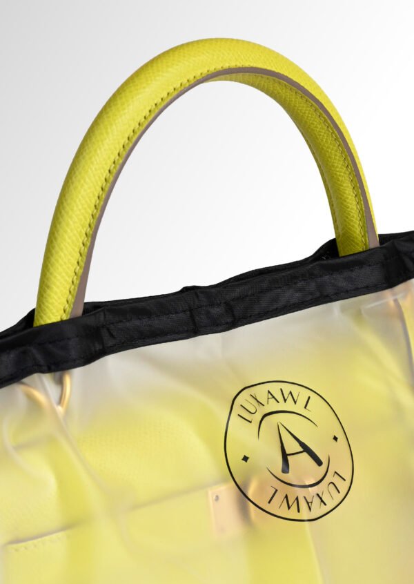 LUXAWL clear bag rain cover with black trim and logo on a hermes kelly bag in colour lime