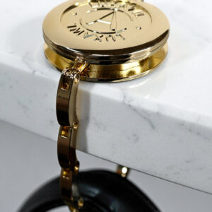 gold-table-hook-for-luxury-bags-on-white-table